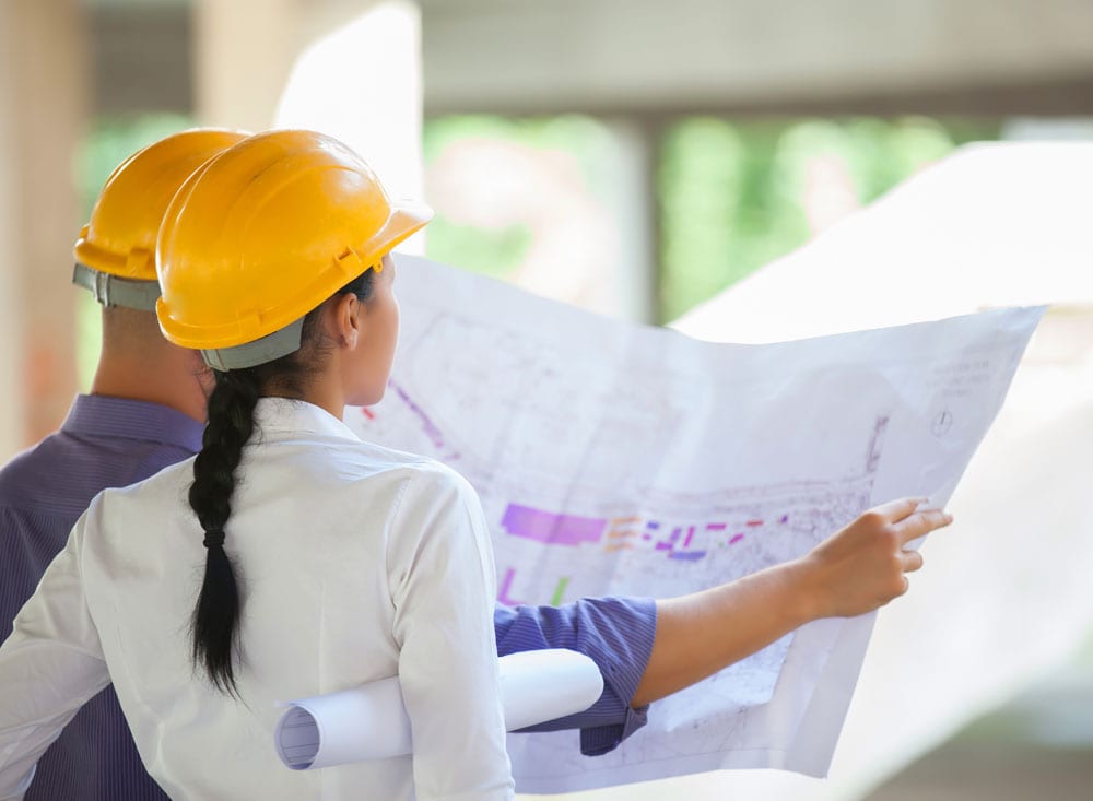 project management project managers taking a look at their blueprint