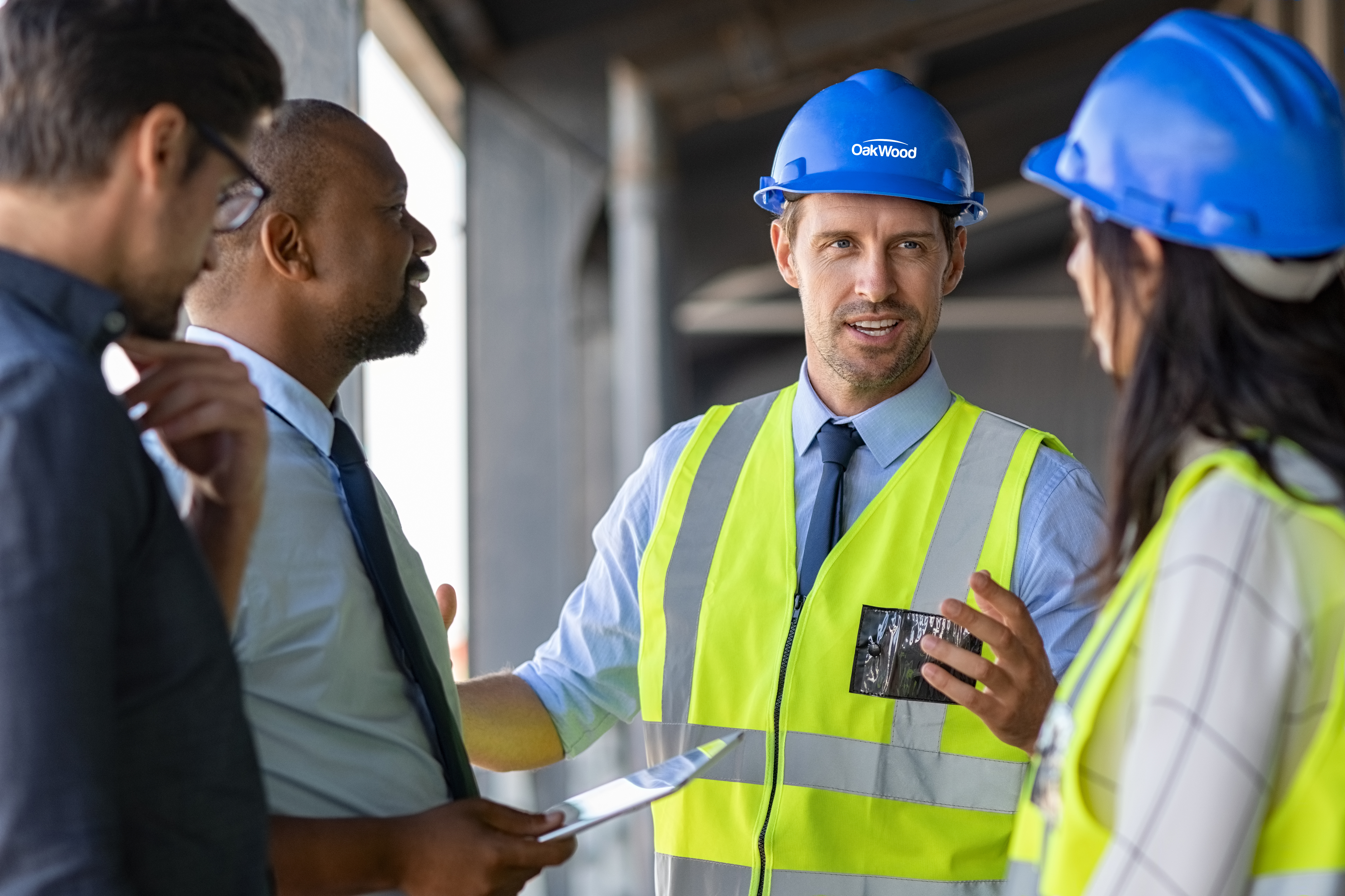 OakWood certified contractors having a discussion with project managers OakWood certified contractors having a discussion with project managers